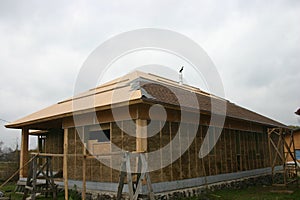 Frame house made of straw.