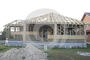 Frame house made of straw. Facade