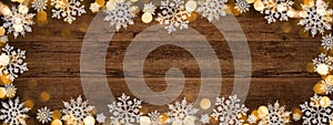 Frame of lights bokeh golden flares, isolated on rustic brown wooden texture - Holiday New Year`s Eve Silvester New Year Party