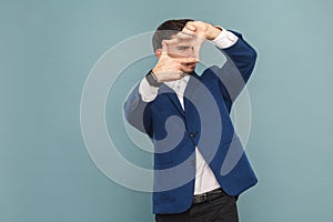 Frame look. Man showing by hands photographer frame