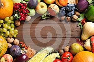 Frame made of autumn vegetables and fruits on background, top view with space for text. Happy Thanksgiving day