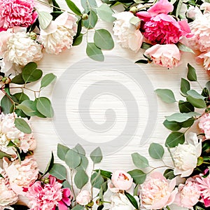 Frame made of beautiful pink peonies on white background. Flat lay, top view. Valentine`s background. Floral frame