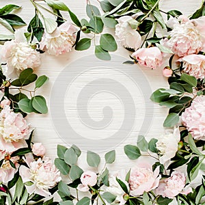 Frame made of beautiful pink peonies on white background. Flat lay, top view. Valentine`s background. Floral frame