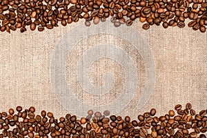 The frame is made of burlap and coffee beans, with space for your creativity, text. Coffee beans on a coarse cloth