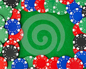 Frame made of casino chips on green table