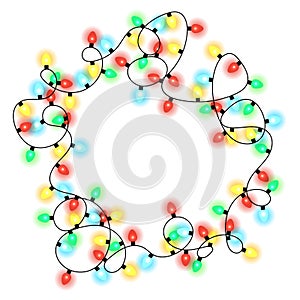 Frame made of christmas multicolored shiny garlands on a white background