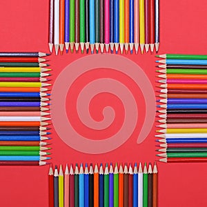Frame made of colorful wooden pencils flat lay