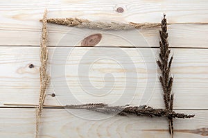 Frame made of different wheats on wood floors