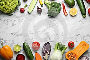 Frame made of fresh ripe vegetables and fruits on marble background, flat lay.