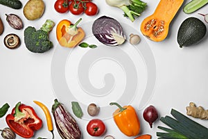 Frame made of fresh ripe vegetables on white background