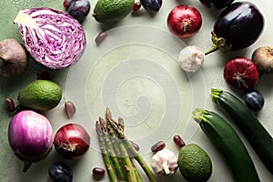 Frame made of fresh vegetables and fruits on light background