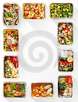 Frame made of healthy food boxes on white background