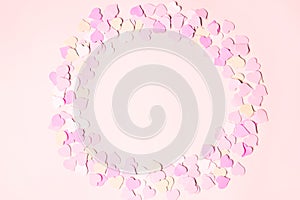 The frame is made of little hearts on a pastel pink background. Concept of Valentine`s, anniversary, mother`s day and birthday