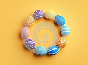 Frame made of painted Easter eggs on color background, top view