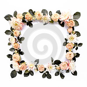 frame made of pink roses, green leaves eucalyptus, branches, floral pattern on white background. Flat lay, top view