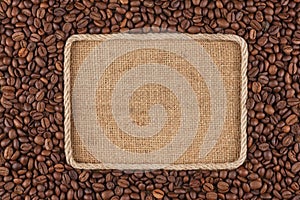 Frame made of rope with coffee beans lying on sacking