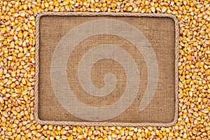 Frame made of rope with corn grains on sackcloth