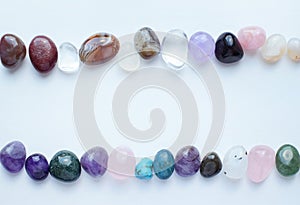 Frame made of semi-precious stones of different colors. Amethyst, rose quartz, agate, apatite, aventurine, olivine, turquoise,