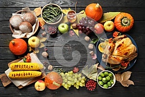 Frame made of turkey, autumn vegetables and fruits on wooden background, flat lay. Happy Thanksgiving day