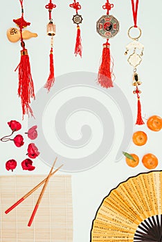 Frame made of various chinese talismans and objects isolated on white, Chinese New Year concept