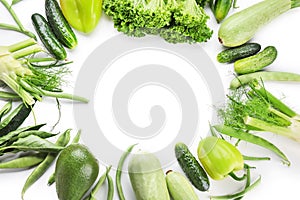 Frame made of various fresh vegetables on white background