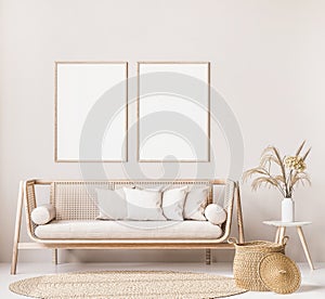 Frame mock up in farmhouse style living room with wooden trendy sofa and white vase with dried flowers