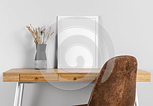 frame mock up table beside vase. High quality photo