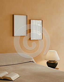 Frame mockup in cozy beige Japandi bedroom interior