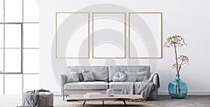 Frame mockup in interior living room design. Three vertical frames on white background with big window.