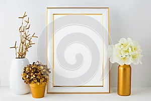 Frame mockup with ivory hydrangea in the golden vase, white vas