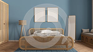 Frame mockup, modern wooden bedroom with rattan furniture in blue tones, double bed with duvet and pillows, carpet, mirror, lamp