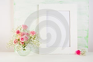 Frame mockup with roses in vase