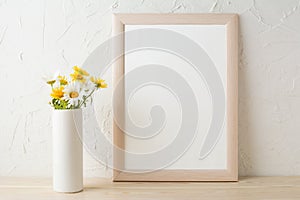 Frame mockup with white and yellow chamomiles in vase