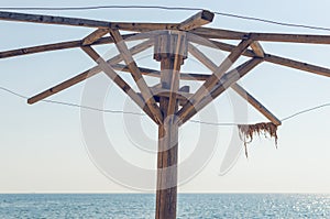 The frame of the old destroyed beach umbrella