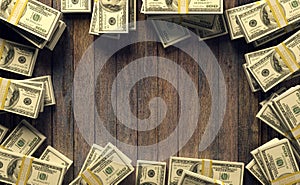 Frame of one hundred dollar bills with copy space for mock up on wood background