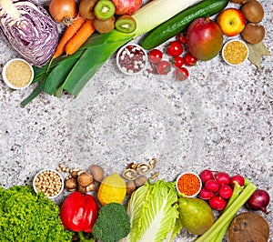 Frame of Organic food on a black background. Fresh vegetables, fruits,cereals and legumes.Vegan and vegetarian concept