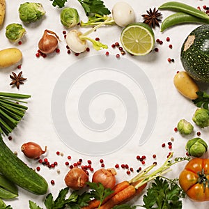 Frame of organic vegetables on white