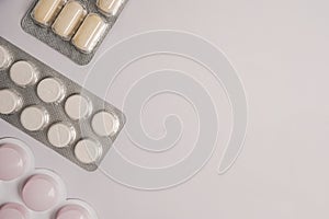 frame from pharmaceuticals antibiotics pills medicine on light gray background, copy space