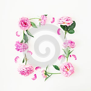 Frame of pink roses and peonies on white background. Floral composition. Flat lay, top view.