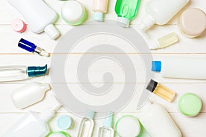 Frame of plastic bodycare bottle Flat lay composition with cosmetic products on wooden background empty space for you design. Set