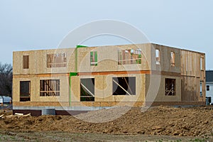 frame plywood walls of a new house under construction lumber material