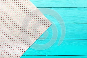 Frame of polka dots texture on blue wooden table. Top view and copy space. Mock up