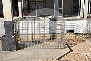 Frame of reinforcement for pouring the formwork of the porch at the entrance of a residential building. Preparatory work for