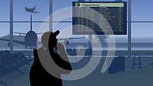 The frame shows an airport with a waiting room. A woman in silhouette looks at the scoreboard and checks the flights