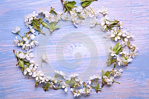 Frame of Spring Flowers on the background of old vintage blue bo