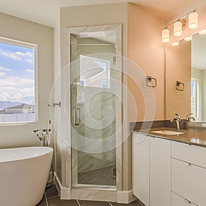 Frame Square Modern bathroom interior with double sink vanity glass door shower and bathtub