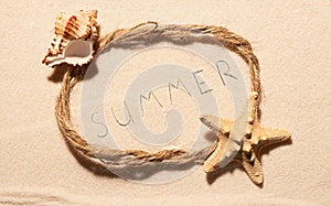 Frame with starfish, empty seashell and summer on sand