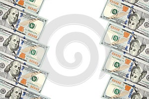 A frame of two rows of bills of one hundred dollars. White background on center line