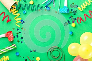 Frame from various celebratory items on green background