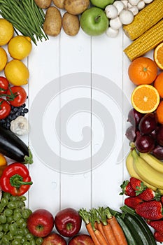Frame from vegetables and fruits like tomato, apple, orange with